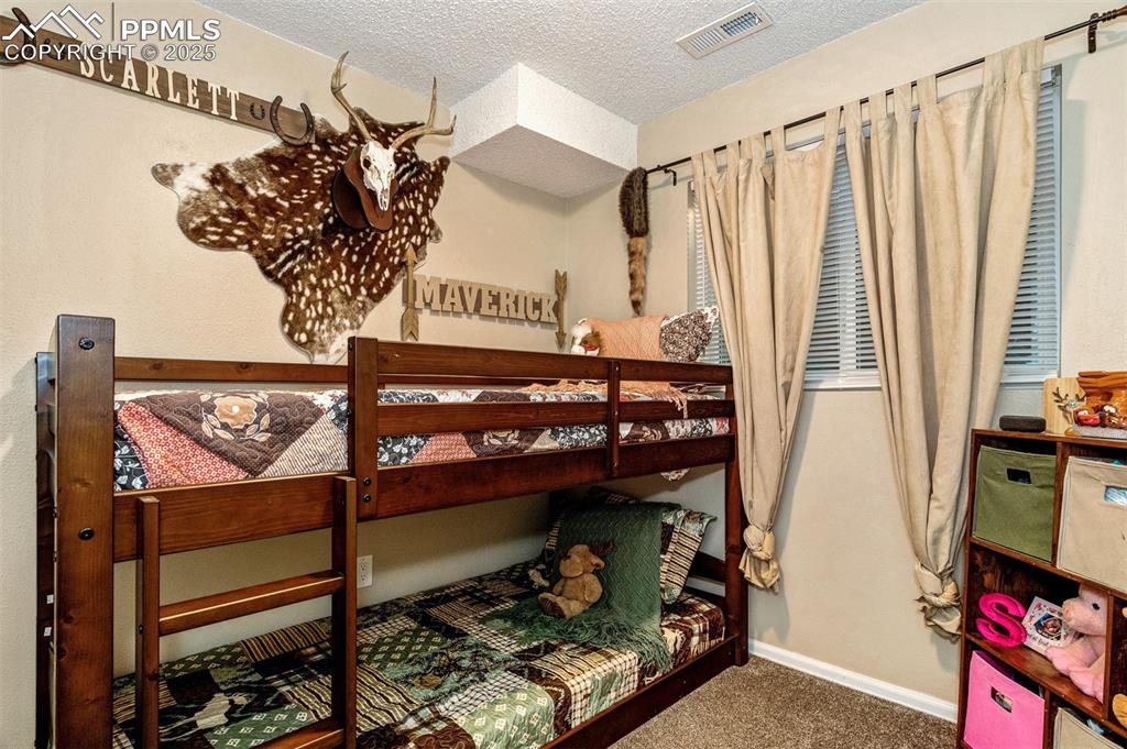 Image 17 of 27: second bedroom on the lower level