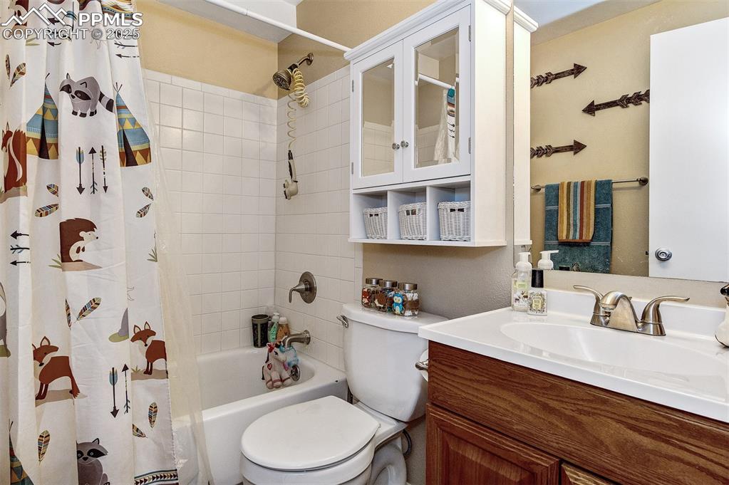 Image 19 of 27: Lower level Full bath with shower / bath combo and vanity