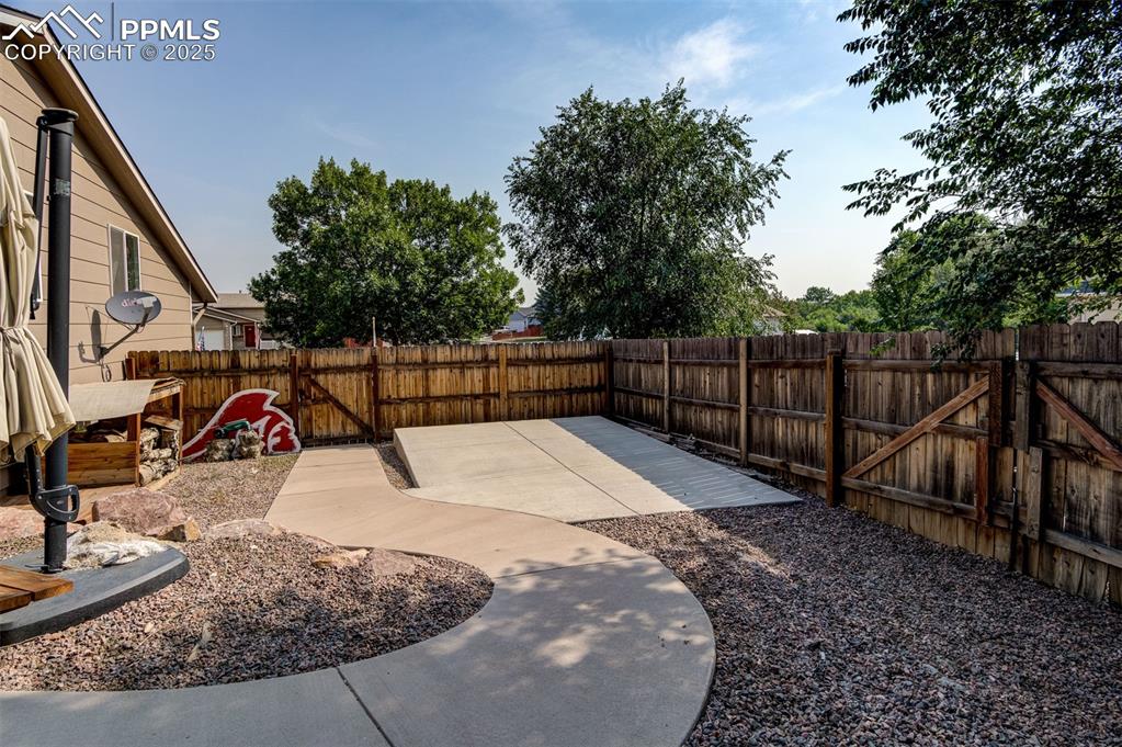 Image 27 of 27: Fenced backyard