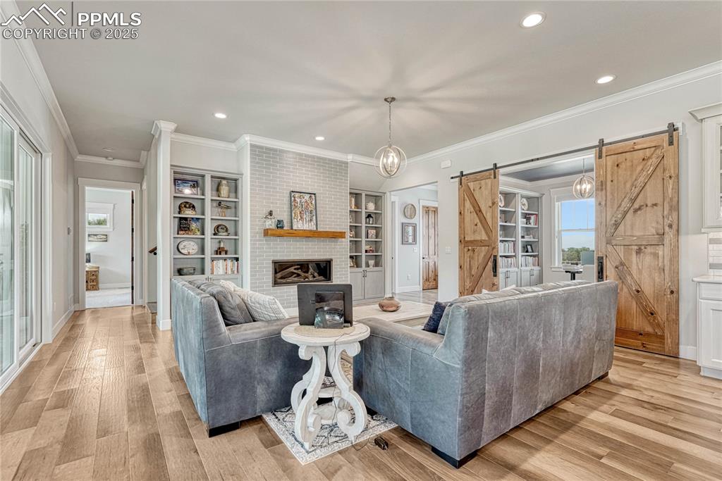 Image 7 of 50: Crown Molding, Fireplace, Living Room