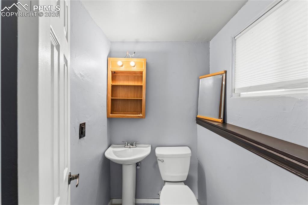 Image 29 of 40: Half bathroom on lower level