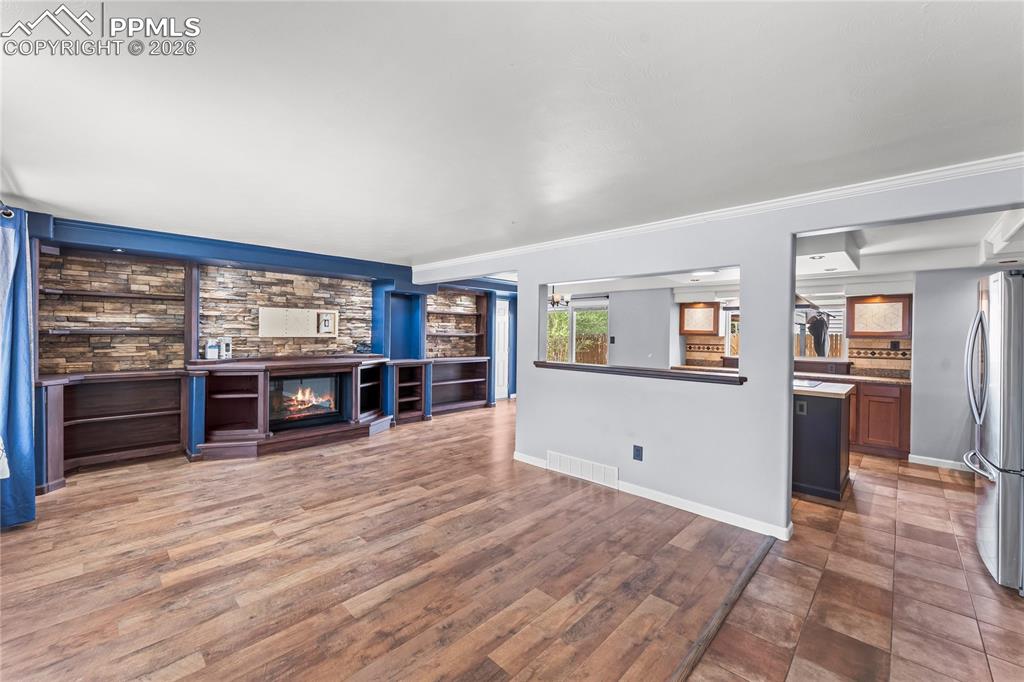 Image 3 of 40: Living room and kitchen from entry