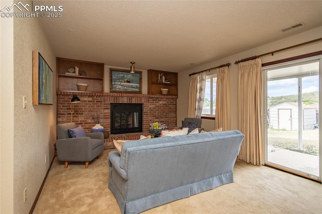 Image 18 of 46: Lots of natural light with these west facing window and door. 