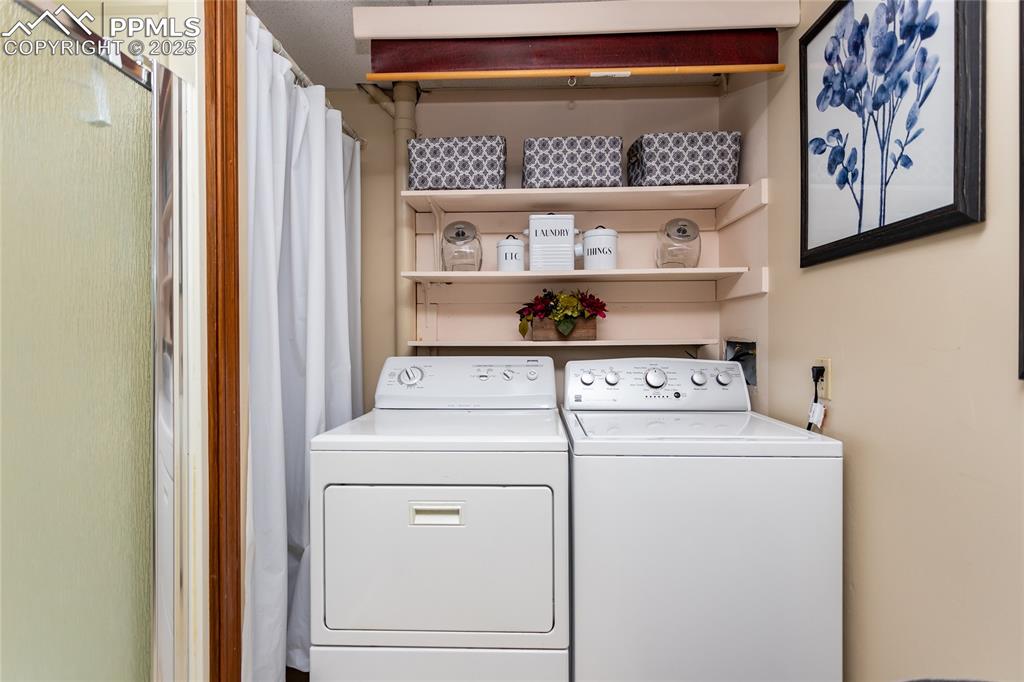 Image 23 of 46: The 3/4 Bath also boasts a washer and dryer - included with the home. 