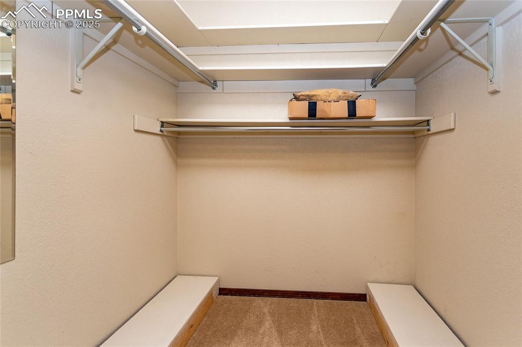 Image 28 of 46: Large walk-in master closet. 