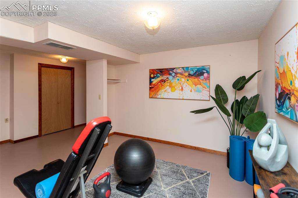 Image 35 of 46: This basement room can be used as another bedroom, play room or excercise r