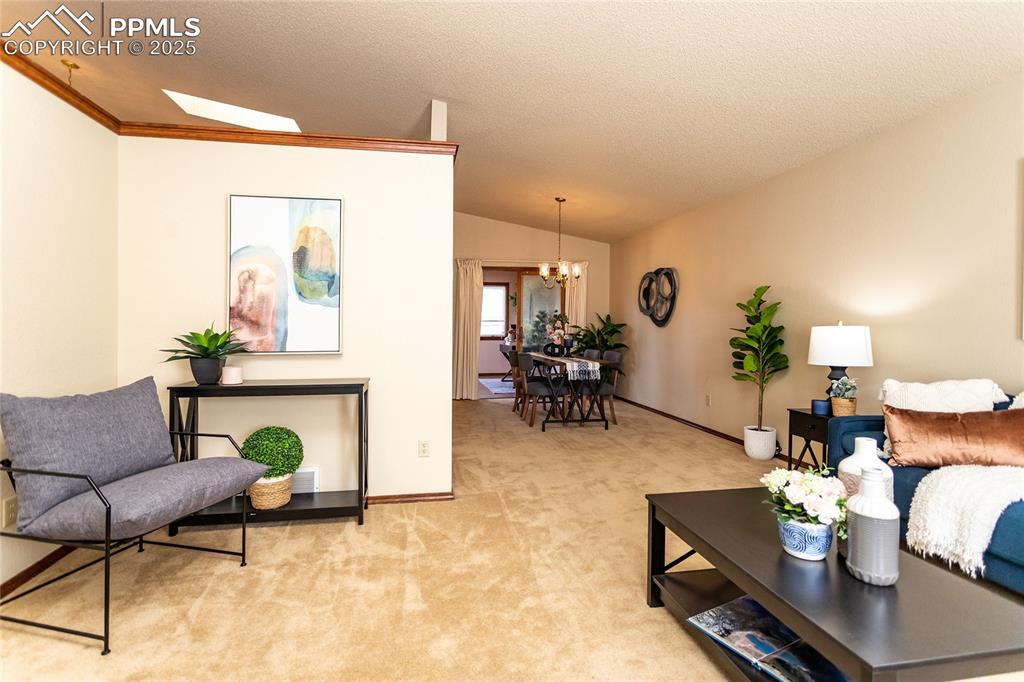 Image 6 of 46: The living room is open to the dining area. 