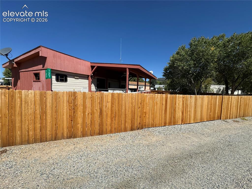 Image 3 of 34: Beautiful upgraded western red cedar fence fully surrounds property for ext