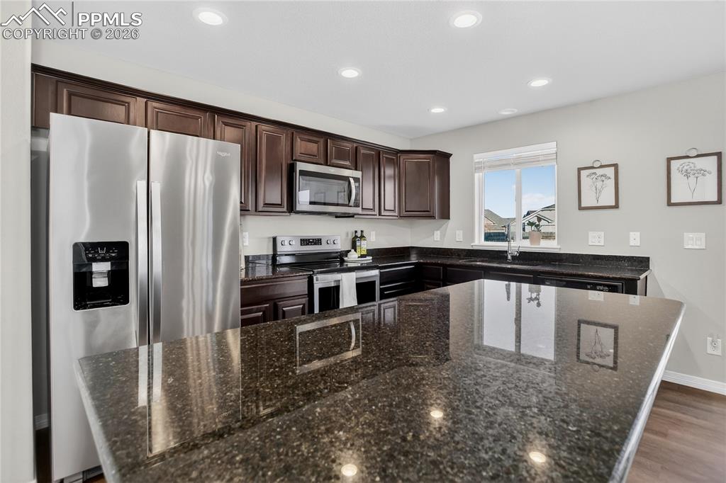 Image 10 of 21: Kitchen w/ SS appliances