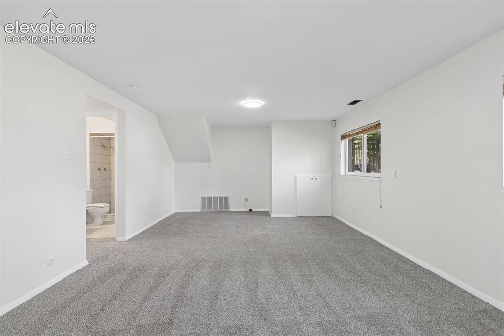 Image 28 of 38: Large Basement Living Room