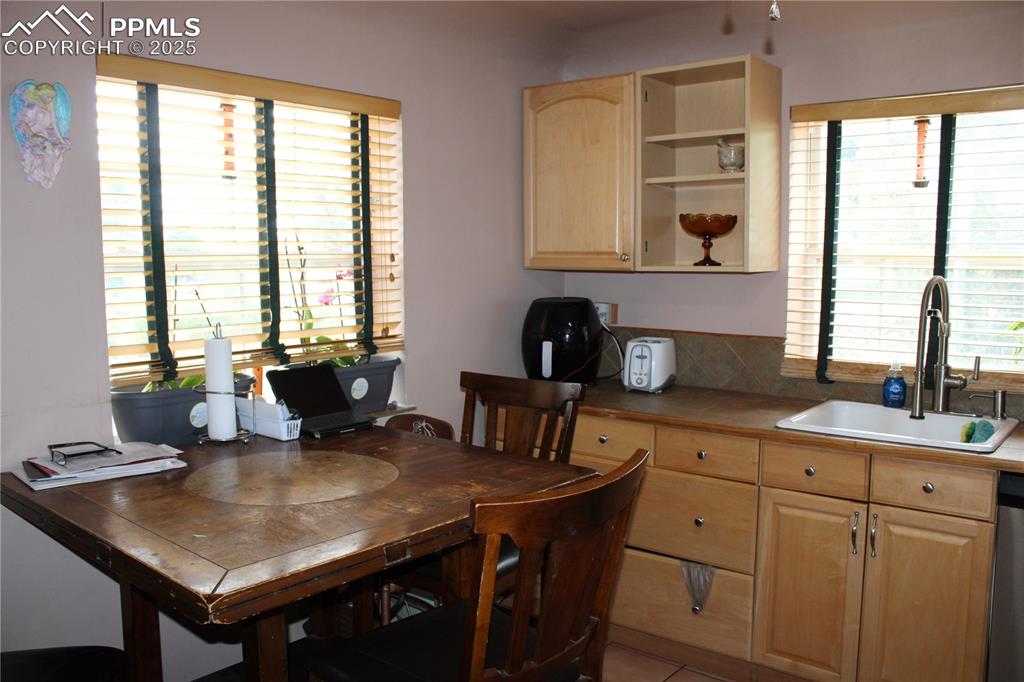 Image 14 of 41: Tiled dining area featuring healthy amount of natural light