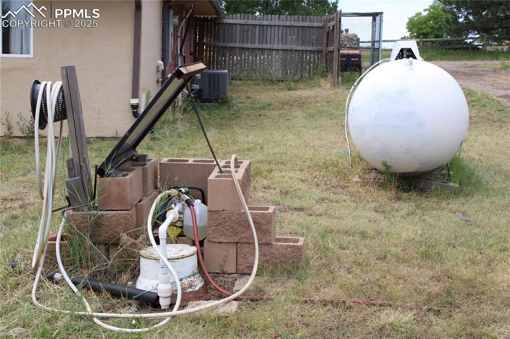 Image 25 of 41: Exterior view of heating fuel tank and a cistern system to capture and then