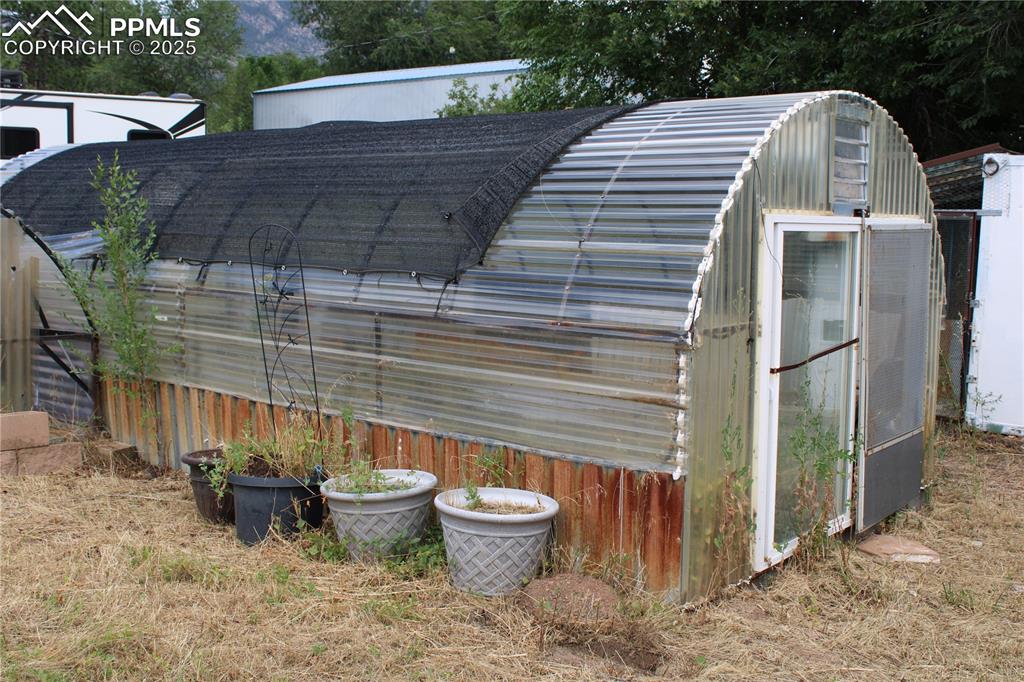 Image 28 of 41: View of greenhouse
