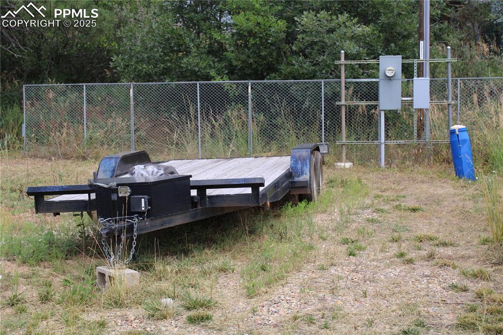 Image 30 of 41: Trailer included and view of second RV hookup.