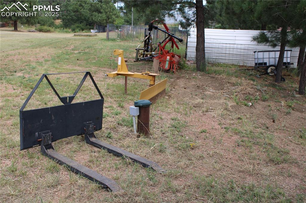 Image 33 of 41: Tractor implements included