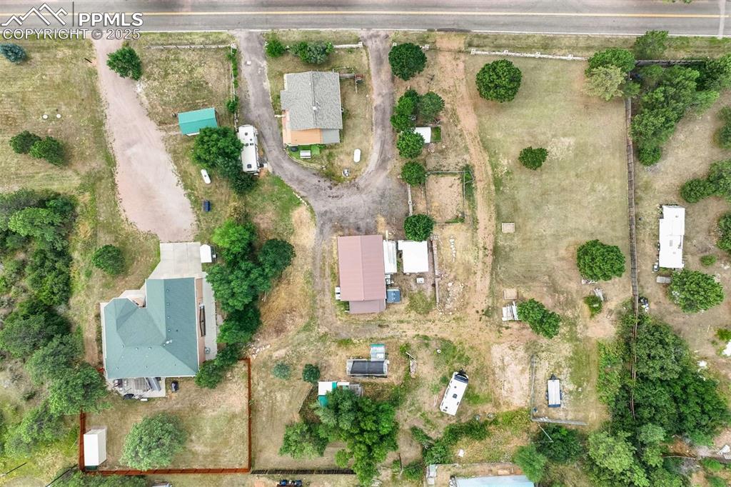 Image 35 of 41: Aerial view of property and surrounding area featuring rural landscape