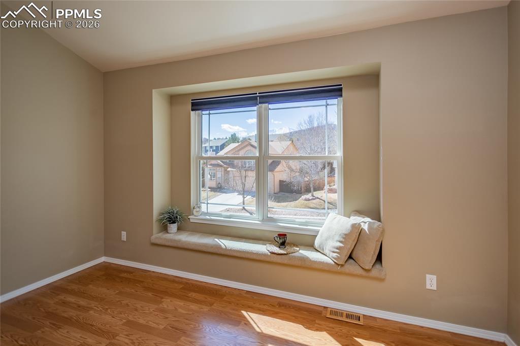 Image 28 of 50: Main bedroom window seat.  You gaze at Pikes Peak through this window.