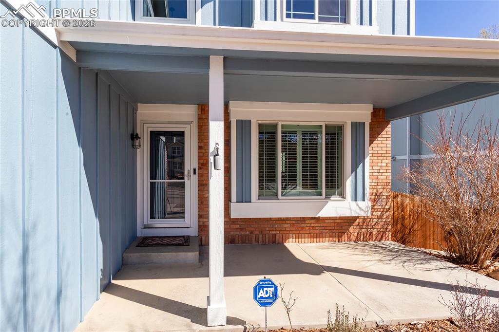 Image 3 of 50: Covered patio offers shade in summer and protection from weather for your g
