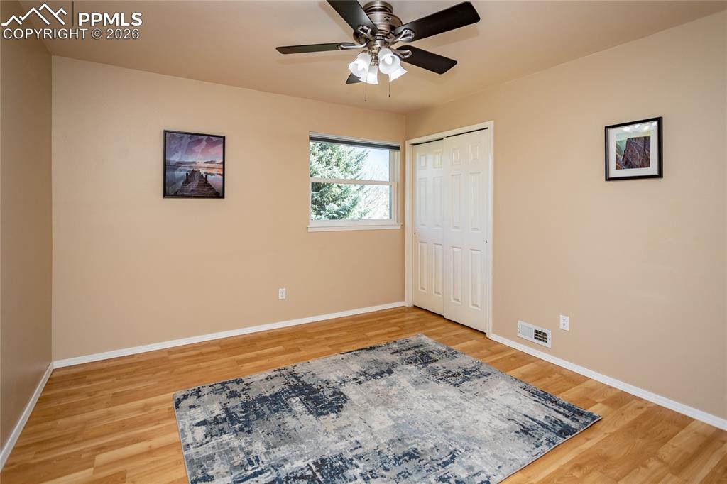 Image 32 of 50: The east facing 2nd bedroom has views of the bluffs & backyard.