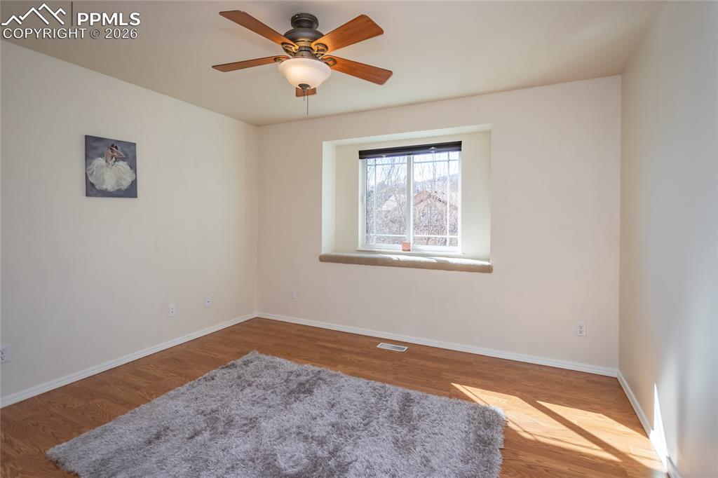 Image 37 of 50: The 4th bedroom is east-facing and has Pikes Peak views.