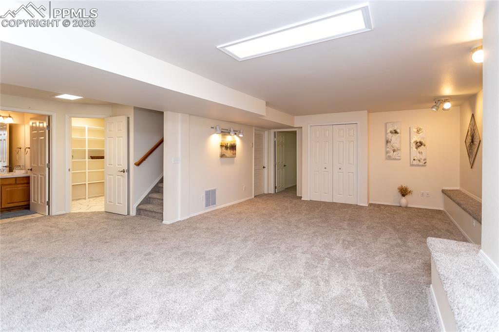 Image 39 of 50: The garden level basement is light & bright with a huge rec room..