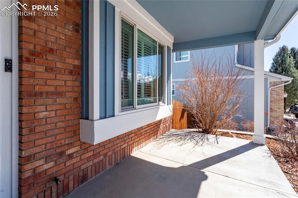 Image 4 of 50: Welcoming front porch is just waiting for your porch swing!