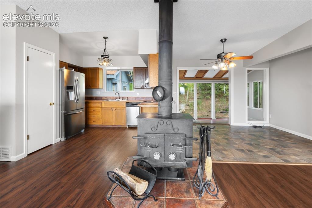 Image 8 of 21: Wood Stove to heat the home