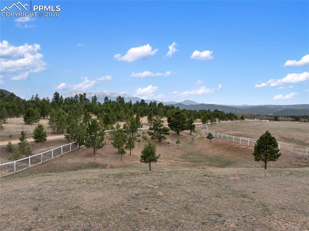 Image 11 of 46: View of yard featuring a view of rural / pastoral area and a mountain view