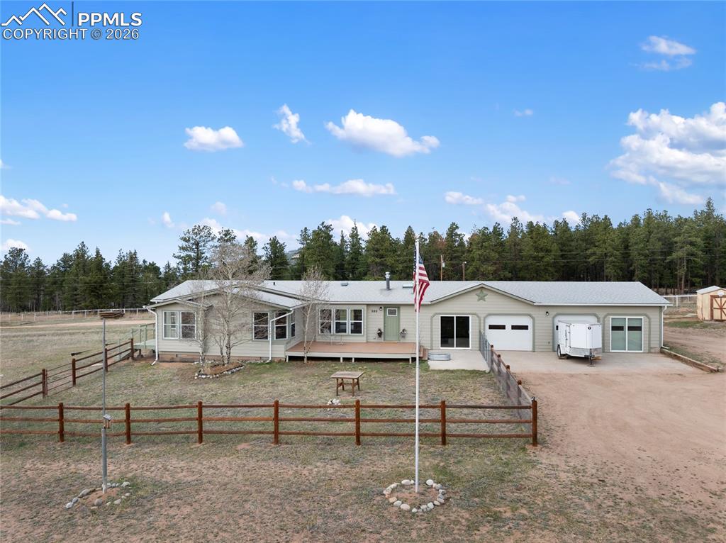 Image 3 of 46: View of front of home with driveway