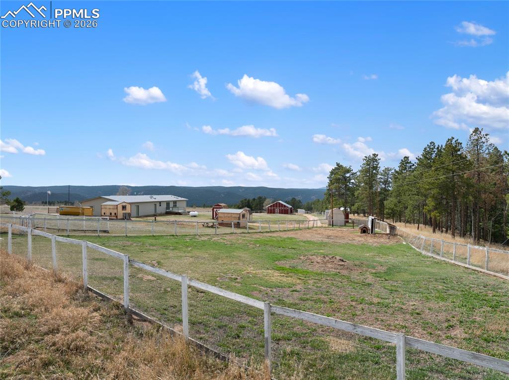 Image 7 of 46: View of yard with a rural view and a mountain view