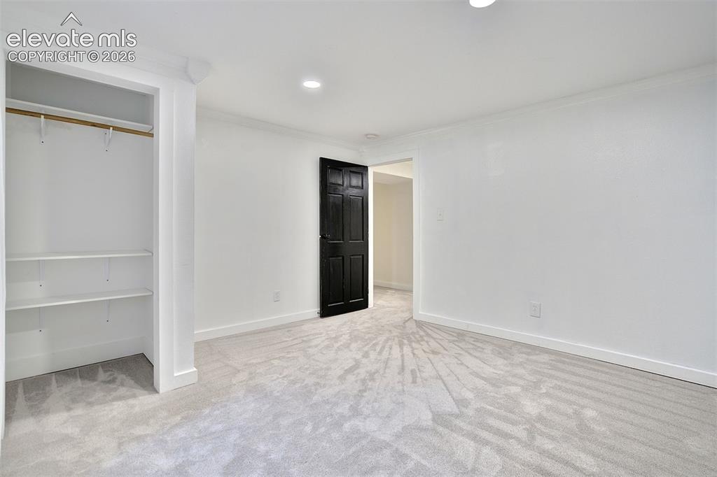 Image 35 of 43: Interior room featuring wall-to-wall carpeting, recessed ceiling lighting,