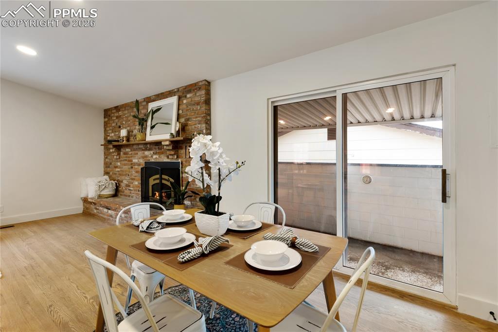 Image 11 of 37: Walk out to the covered patio from the kitchen/dining area.