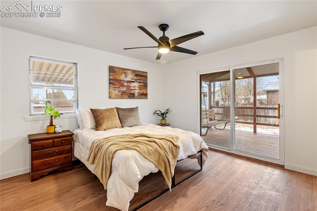 Image 12 of 37: Primary bedroom is spacious, features refinished hardwood flooring, walks o