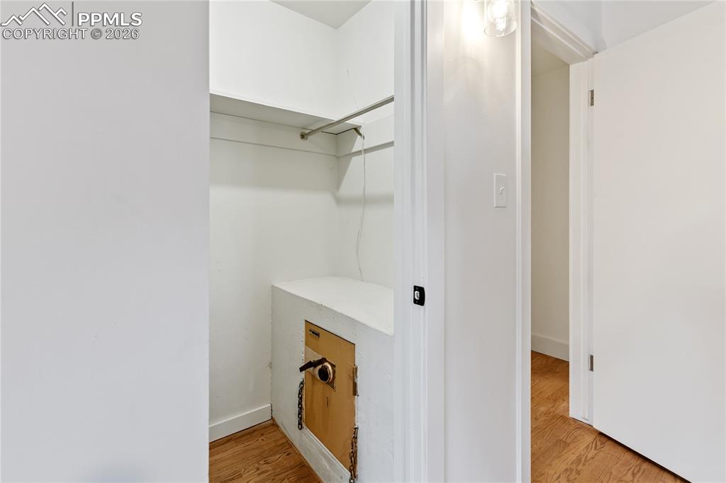 Image 16 of 37: Primary bedroom features walk-in closet complete with a built-in safe.