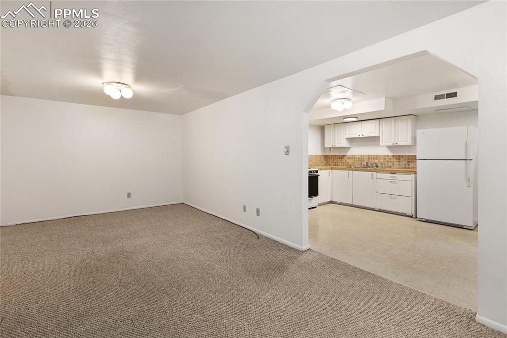 Image 24 of 37: Basement family room.