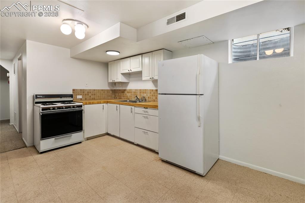 Image 25 of 37: 2nd kitchen in the basement.