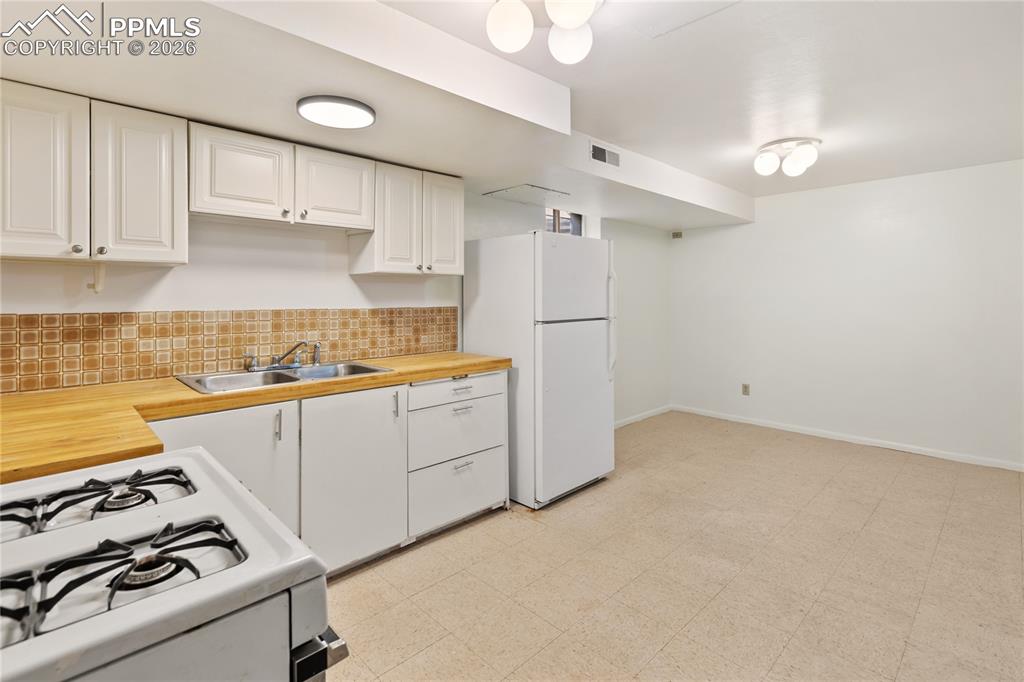 Image 27 of 37: 2nd kitchen in the basement