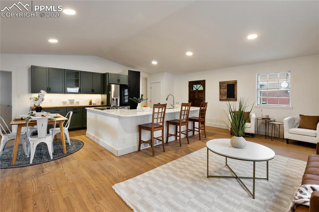 Image 3 of 37: Beautifully remodeled kitchen, dining and living room - All new cabinets, a