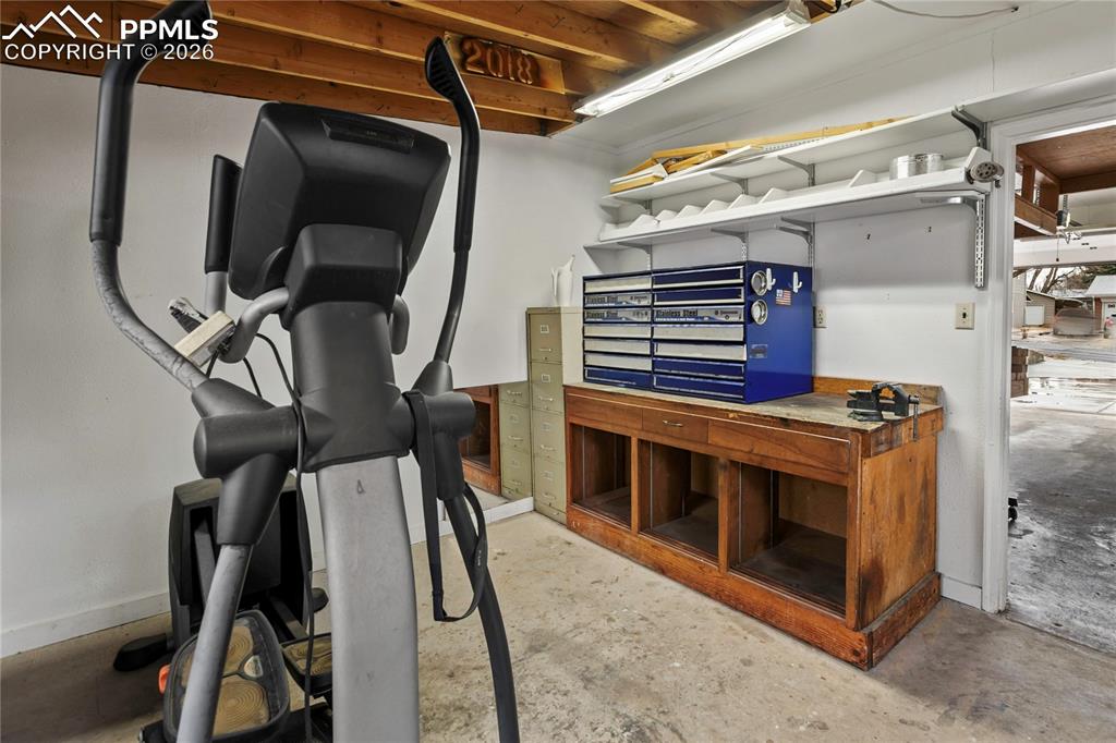 Image 34 of 37: Workshop that is connected to the attached one car garage.