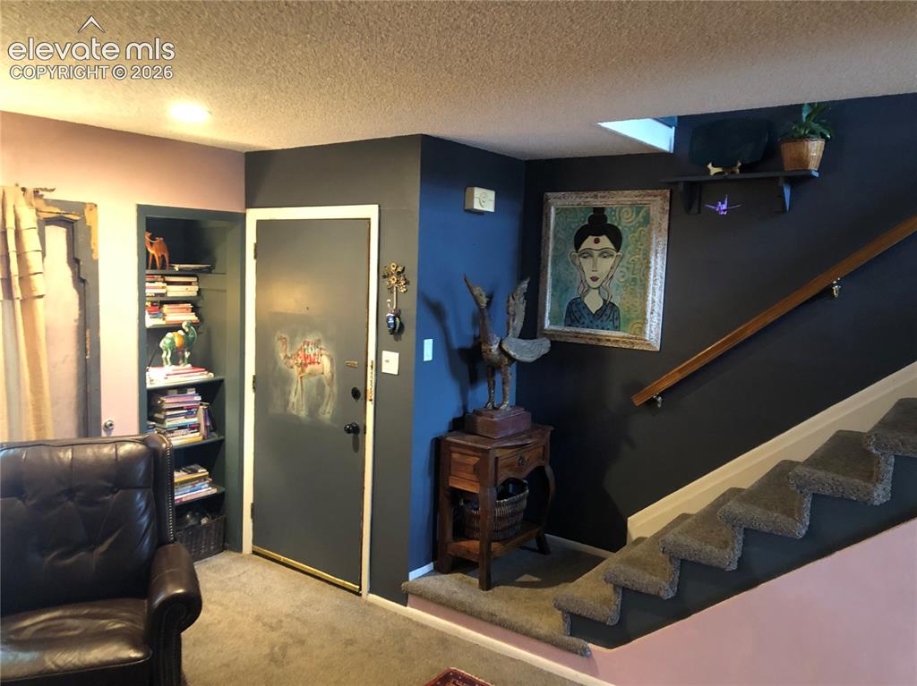 Image 3 of 25: living room entry door