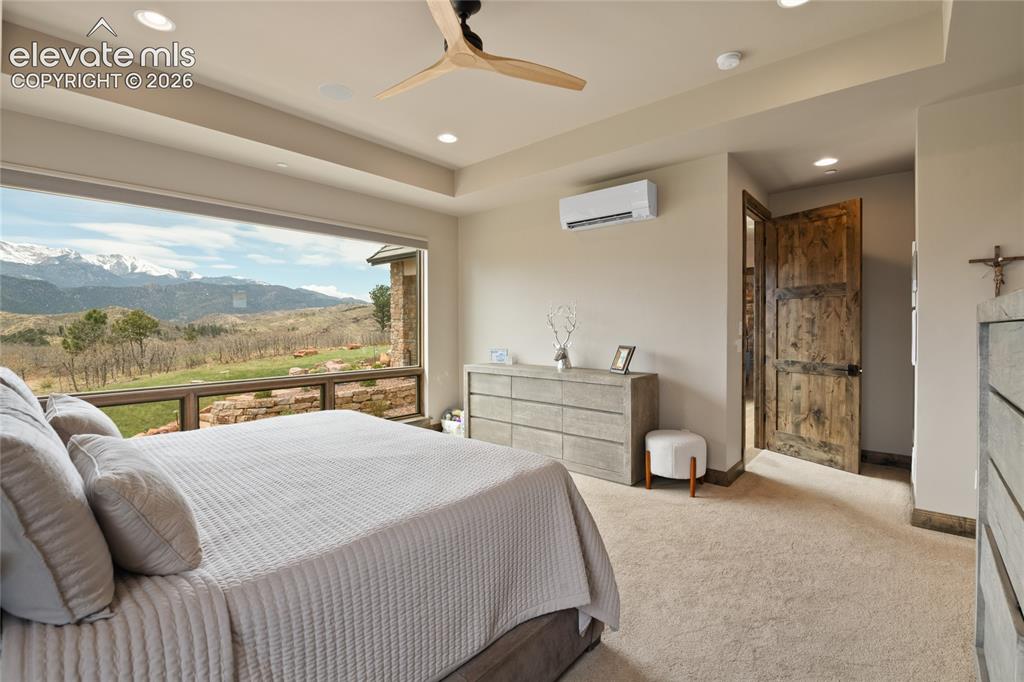 Image 23 of 50: The view that earns its rest. Spacious primary retreat featuring a recessed