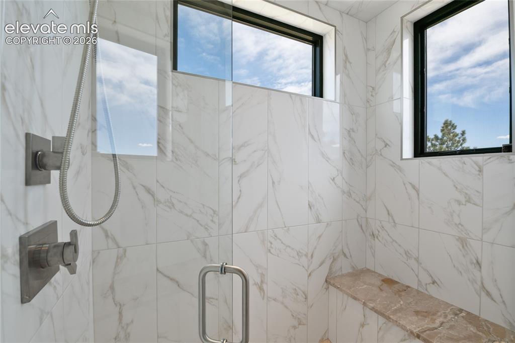 Image 25 of 50: Where every morning starts like a five-star getaway. Full-slab marble steam