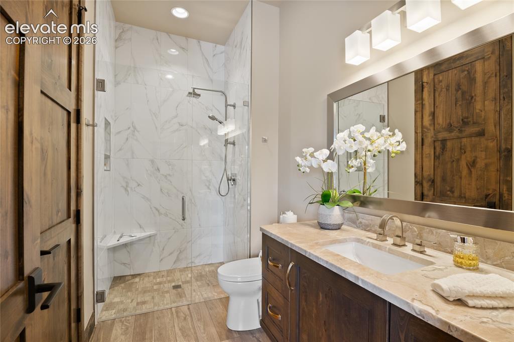 Image 31 of 50: Guests will never want to leave. Private ensuite bath with curbless walk-in