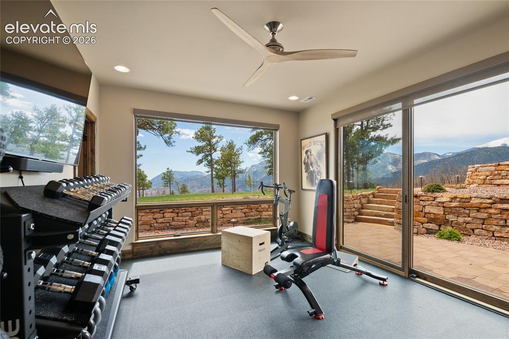 Image 40 of 50: Why drive to the gym when this is the view? Lower-level fitness room with w