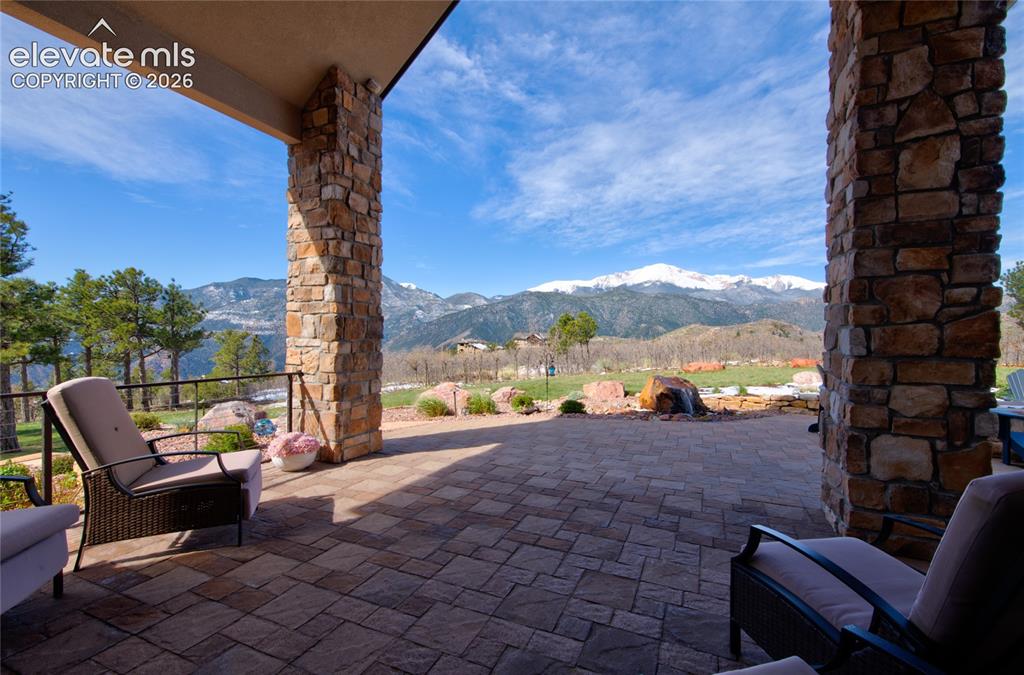 Image 43 of 50: The best seat in Colorado Springs. Covered main-level patio with paver floo