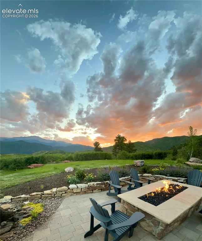Image 47 of 50: Golden hour at the fire pit, with Pikes Peak as your backdrop.