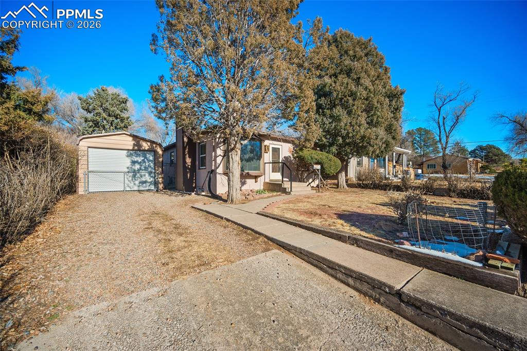 Image 47 of 48: Covered carport.