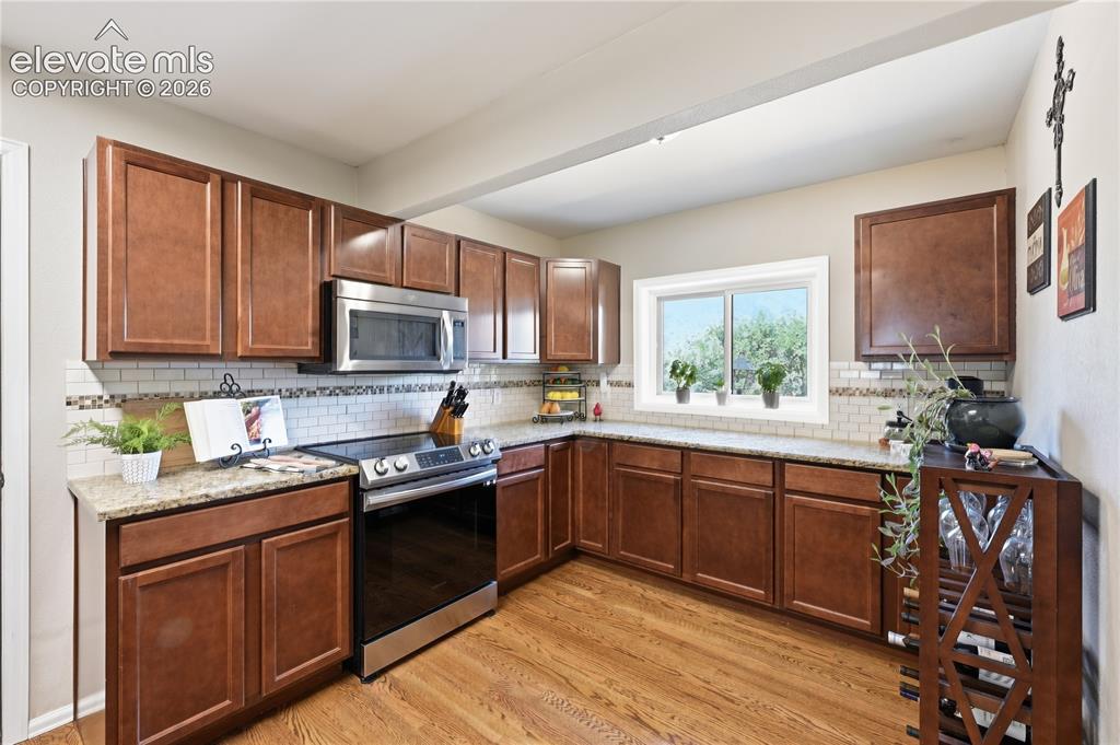 Image 11 of 44: updated in 2013 by previous owners Fabulous views out the window looking We