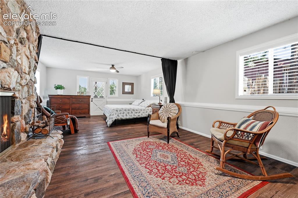 Image 17 of 44: Lower level family room view towards walk out door to back patio.  Owner us