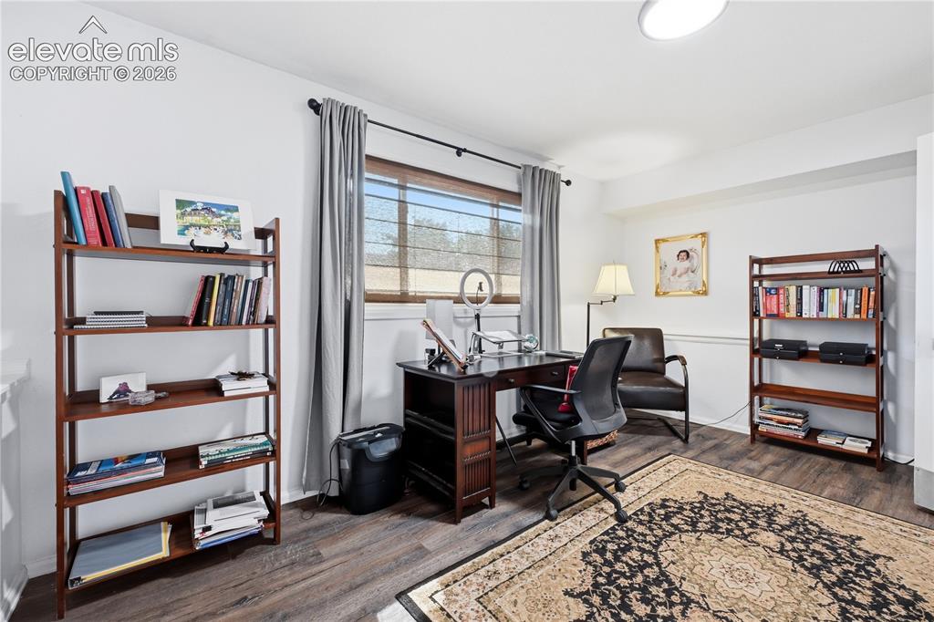 Image 18 of 44: Lower level bedroom with walkout offering rental potential with a private/s